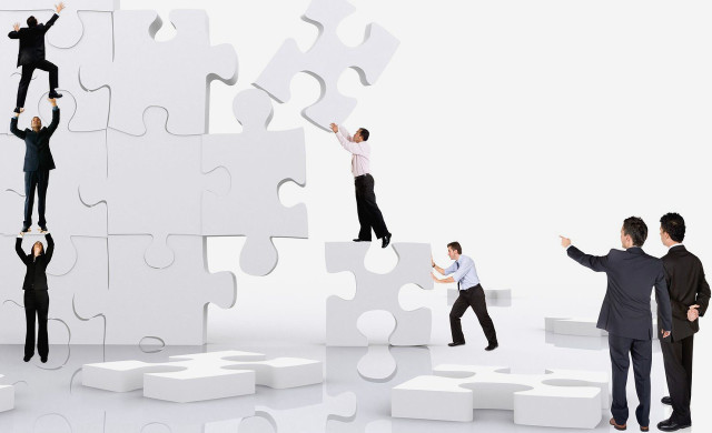 Group puzzle wall reaching man free wallpaper - medium preview image