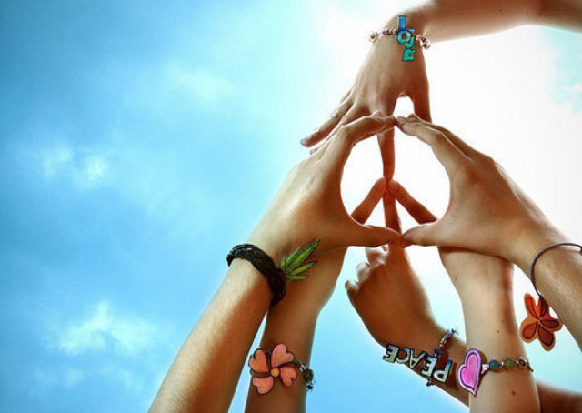 Peace sign flowers holding hands free wallpaper - medium preview image