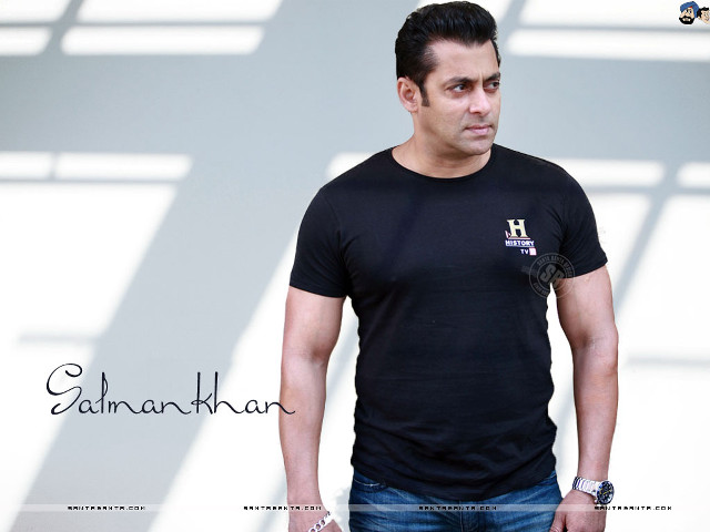 Man black shirt white wall #2 free wallpaper - medium preview image