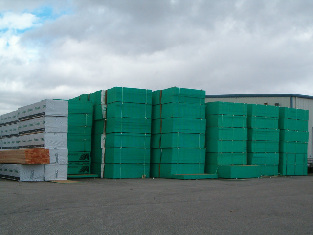 Green barrels stack building cloudy free wallpaper - medium preview image