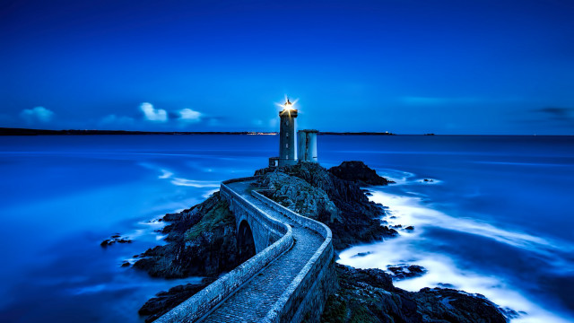 Lighthouse rocky shore blue sky free wallpaper - medium preview image