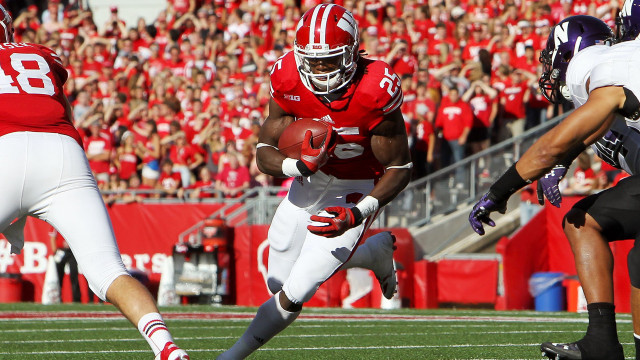 Football player running ball crowd #2 free wallpaper - medium preview image