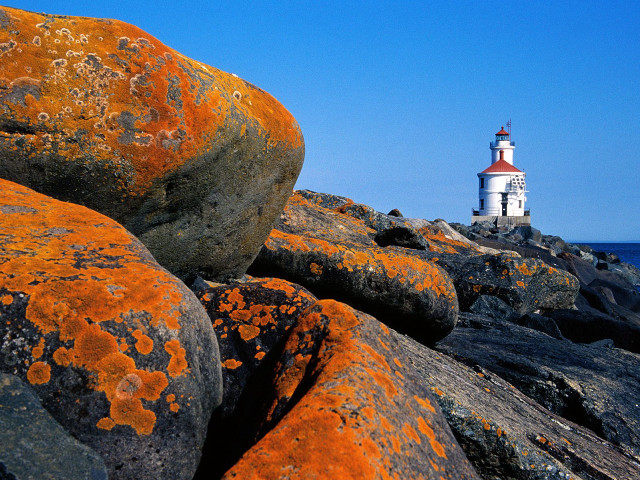 Lighthouse rocky shore orange lichens free wallpaper - medium preview image