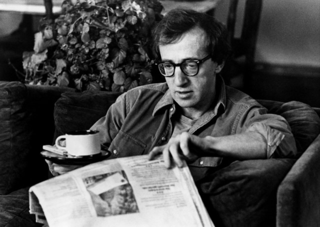 Man couch reading newspaper drinking free wallpaper - medium preview image