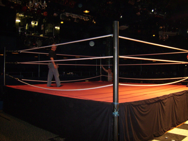 Man standing wrestling ring racquet free wallpaper - medium preview image
