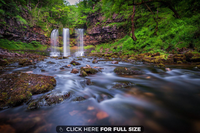 Waterfall rocks foreground forest background free wallpaper - medium preview image