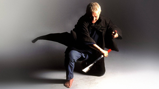 Man holding bat studio pose free wallpaper - medium preview image