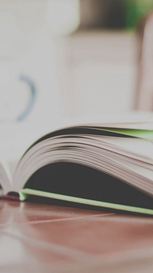 Open book table blurry background free wallpaper - medium preview image