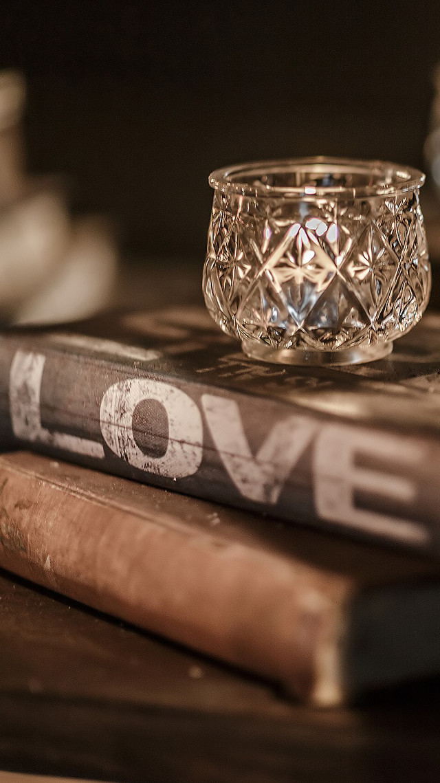 Glass candle holder book stack free wallpaper - medium preview image