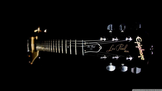 Guitar closeup black background gold free wallpaper - medium preview image