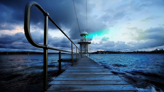 Pier lighthouse night cloudy sky free wallpaper - medium preview image