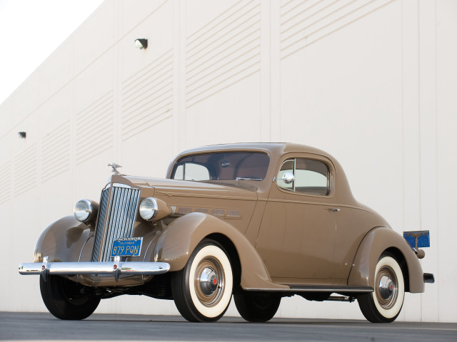 Brown car parked building white free wallpaper - medium preview image