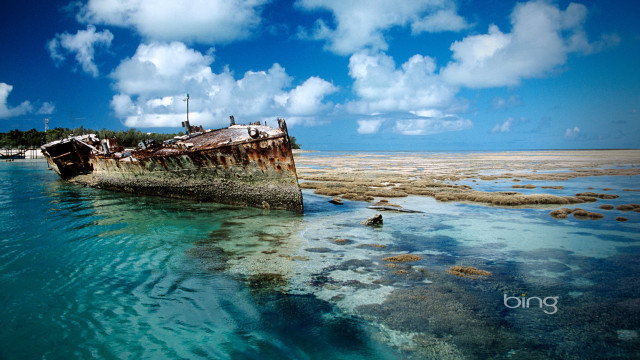 Ship beach water sky clouds free wallpaper - medium preview image