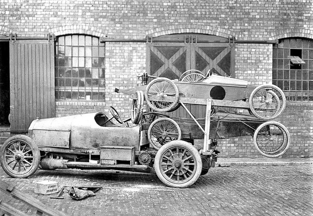 Car wheels parked building brick free wallpaper - medium preview image