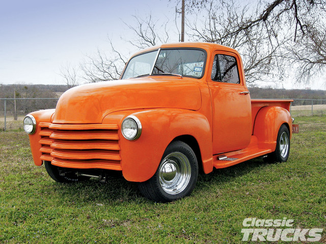 Orange truck parked field grass free wallpaper - medium preview image