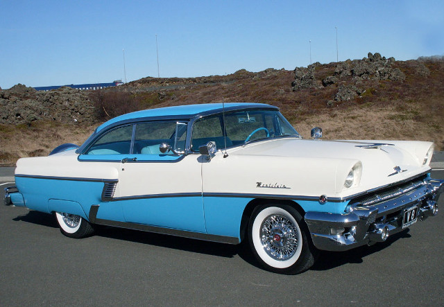 Blue white car parked hill free wallpaper - medium preview image