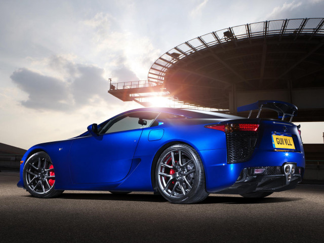 Blue sports car stadium sun free wallpaper - medium preview image