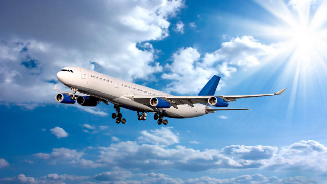 Jetliner flying blue sky clouds #14 free wallpaper - medium preview image