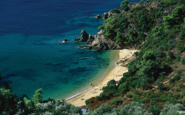 Beach rocky cliff water boat free wallpaper - medium preview image