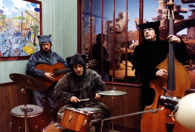 Costumed people playing instruments room free wallpaper - medium preview image