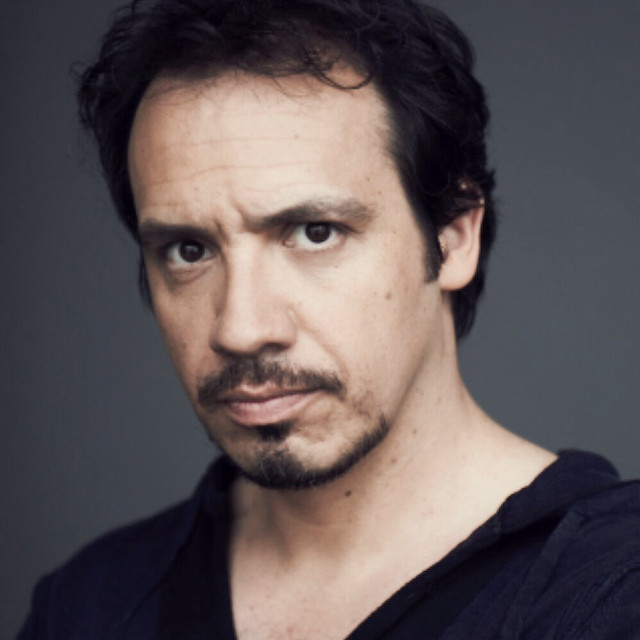 Mustached man black shirt gray free wallpaper - medium preview image