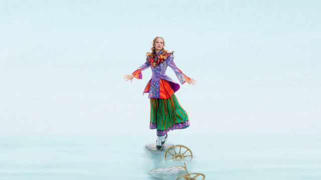 Woman colorful dress balancing wheel free wallpaper - medium preview image