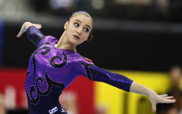 Gymnastics arabesque purple leotard beam free wallpaper - medium preview image