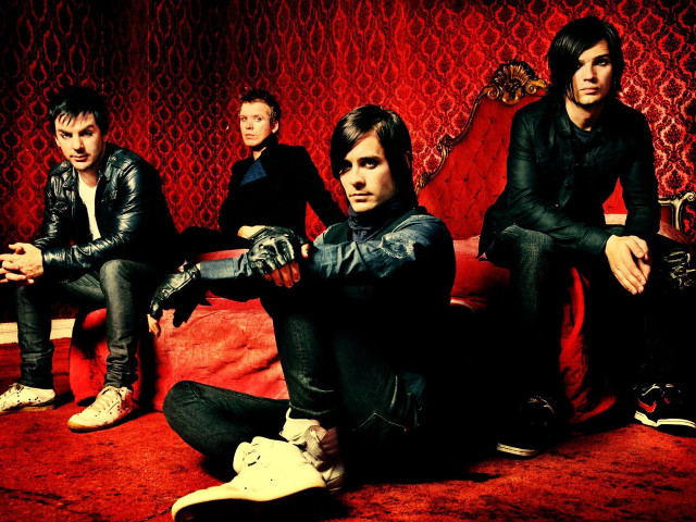 Men sitting red couch carpet free wallpaper - medium preview image