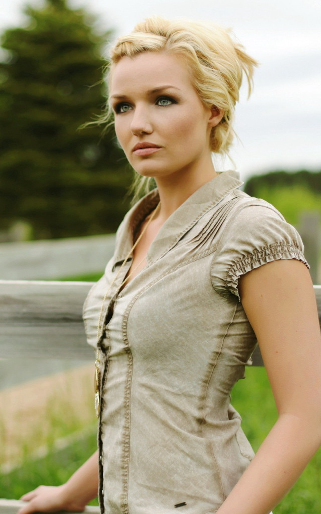 Woman standing fence field grass free wallpaper - medium preview image