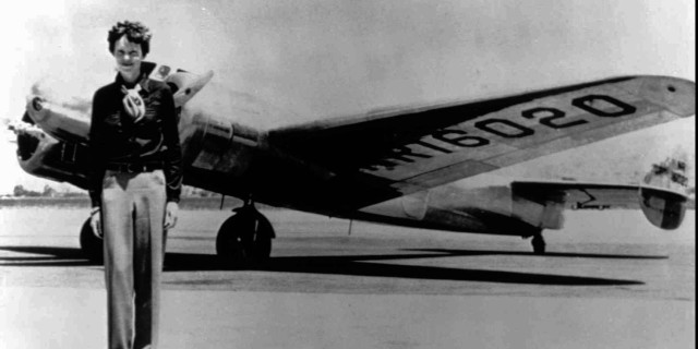 Man standing small airplane runway free wallpaper - medium preview image
