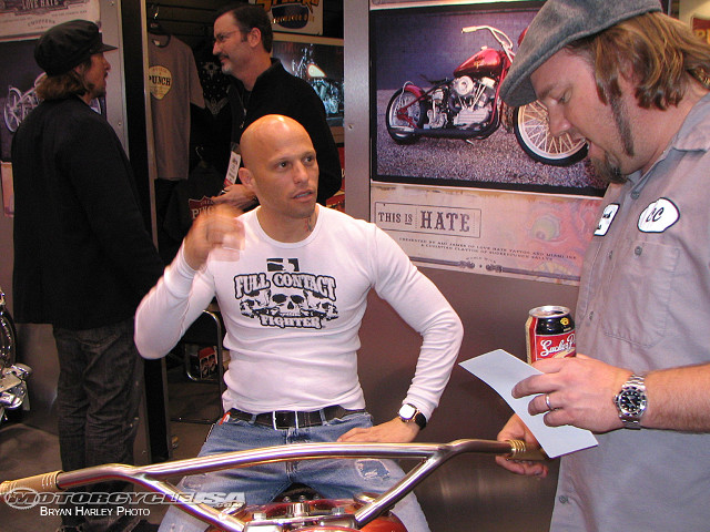 Man talking motorcycle shop beer free wallpaper - medium preview image