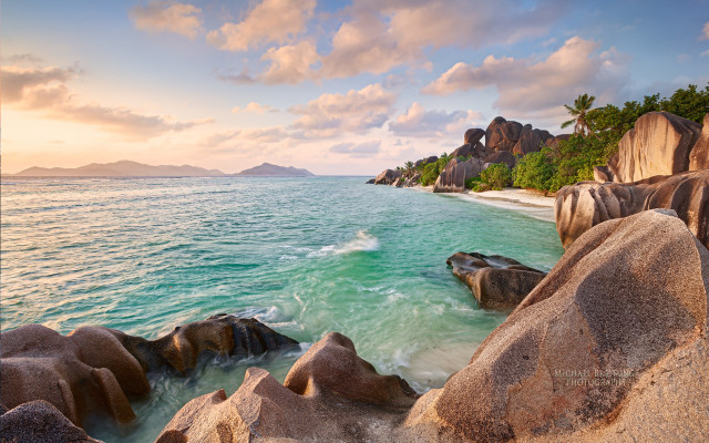 Beach rocks mountain cloudy sky free wallpaper - medium preview image