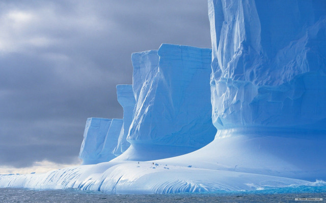 Iceberg boat ocean mountains cloudy free wallpaper - medium preview image