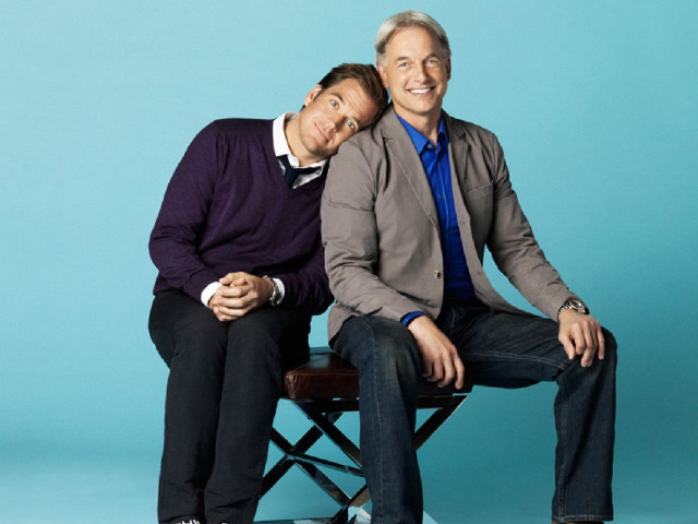 Two men sitting chair posing free wallpaper - medium preview image