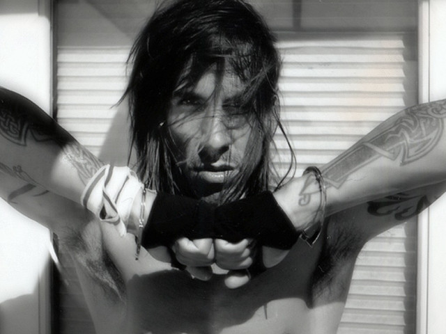 Man tattoos gun serious look free wallpaper - medium preview image