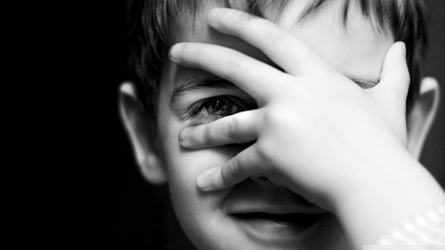 Young boy hands face eyes free wallpaper - medium preview image