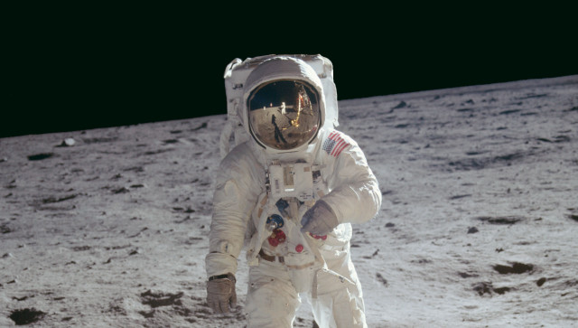 Astronaut walking on moon space free wallpaper - medium preview image