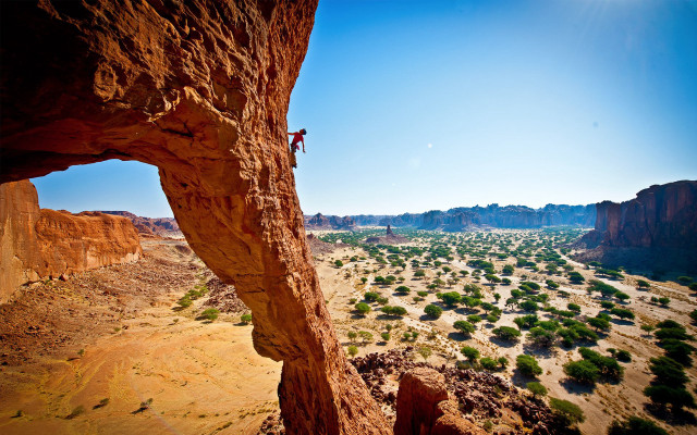 Man climbing cliff desert valley #2 free wallpaper - medium preview image