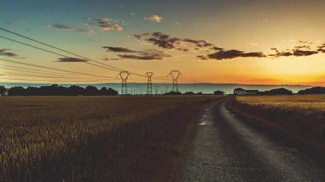 Road field powerlines sunset horizon free wallpaper - medium preview image