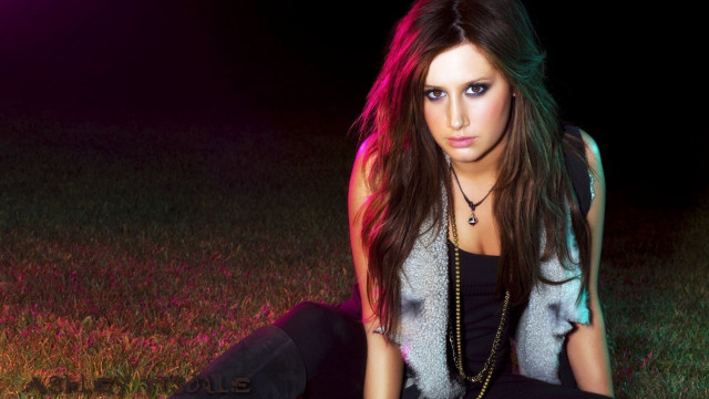 Woman sitting grass field necklace free wallpaper - medium preview image