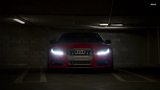 Red car parked night headlights free wallpaper - medium preview image