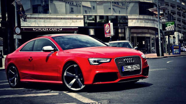 Red car parked street building free wallpaper - medium preview image