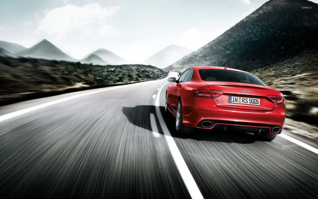 Red car mountain road clouds free wallpaper - medium preview image