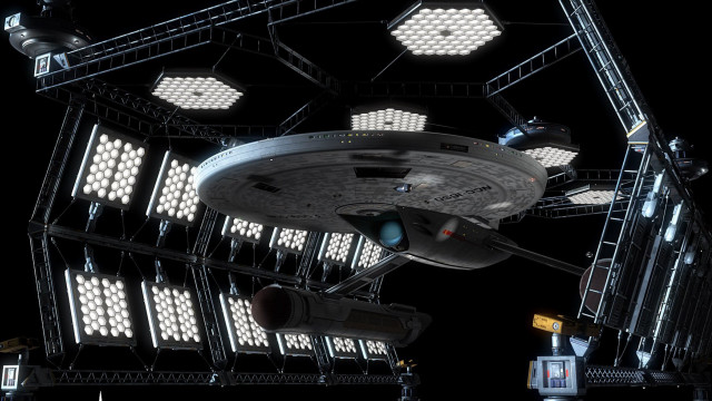 Large spaceship lit up military free wallpaper - medium preview image