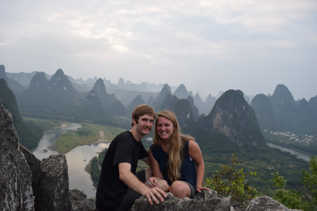 Man woman rock mountains river free wallpaper - medium preview image
