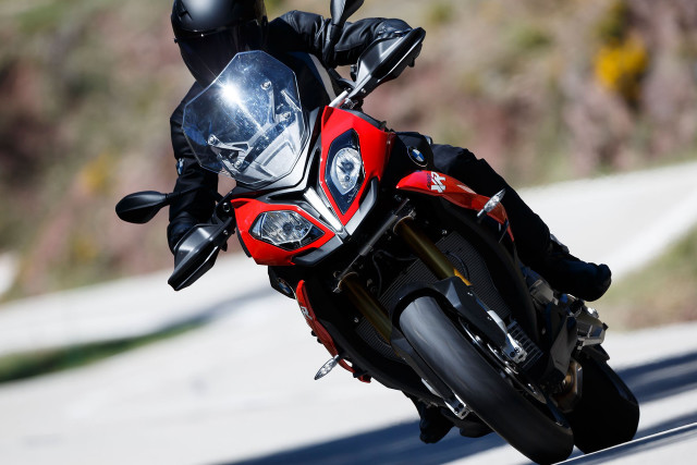 Person riding motorcycle road helmet free wallpaper - medium preview image