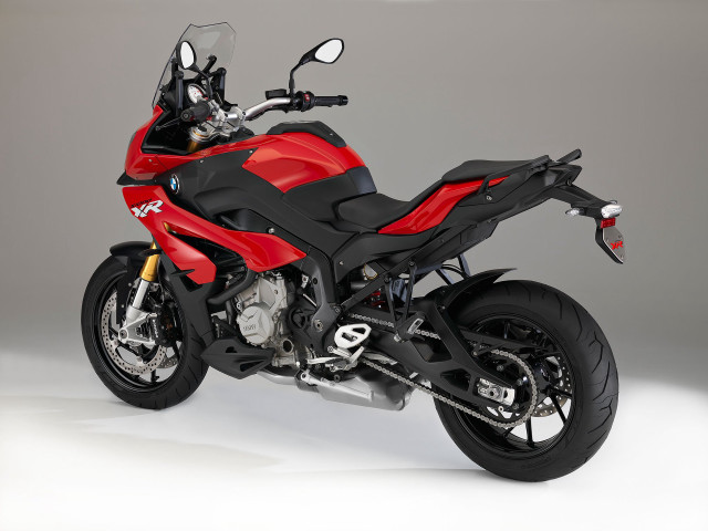 Red motorcycle parked white gray free wallpaper - medium preview image