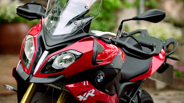 Motorcycle closeup driveway plant background free wallpaper - medium preview image