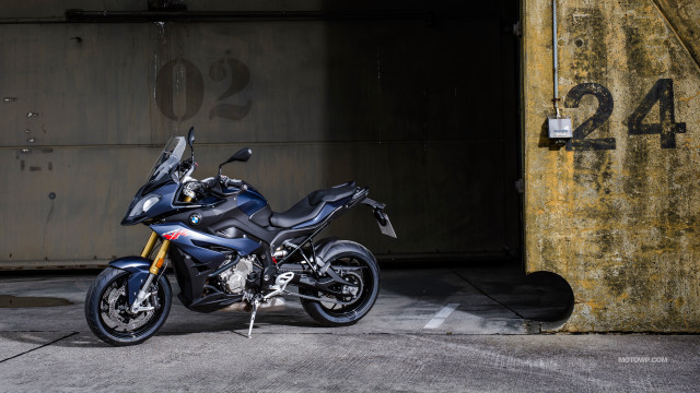 Motorcycle parked parking lot building #2 free wallpaper - medium preview image