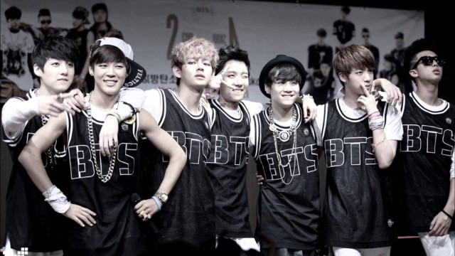 Young men crowd black white free wallpaper - medium preview image